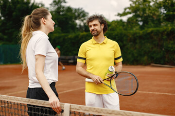 Two tennis players talking on a tennis court before the match - Powered by Adobe