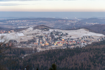 Panoramic view from the top of Dzikowiec Mountain, in Boguszow-Gorce near Walbrzych in Poland. Branches in foreground, selective focus. Popular viewing tower.