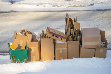 stacking cardboard boxes for curbside recycle