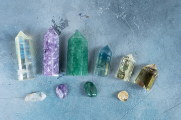 Gemstones minerals obelisks row over gray background. Magic healing Rock for Reiki Crystal Ritual,...