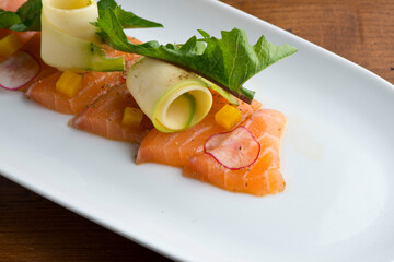 Sashimi sushi. Classic Traditional Japanese cuisine. Raw fish-salmon tuna, mackerel, fluke, bass--sliced very thin and served with a variety of garnishes pickled ginger and wasabi and sauces. 