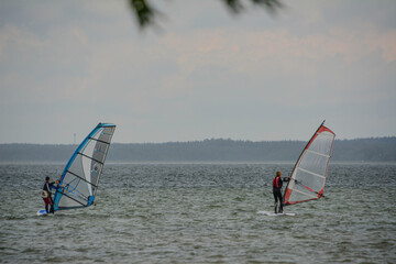 Two windsurfers on the lake 