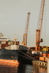 container ship uploading in commercial dock harbor