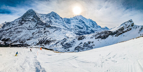 Fototapeta na wymiar Ski slopes and mountains in Jungfrau ski resort in Swiss Alps, Grindelwald, Switzerland