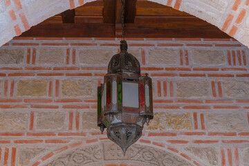 An old lamp on the territory of the Orthodox Church in the summer