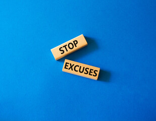 Stop excuses symbol. Concept words Stop excuses on wooden blocks. Beautiful blue background. Business and Stop excuses concept. Copy space.