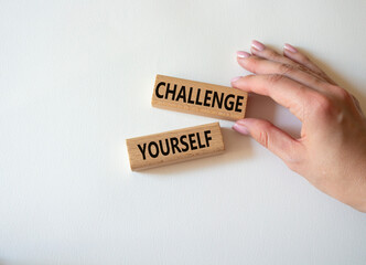 Challenge yourself symbol. Wooden blocks with words Challenge yourself. Businessman hand. Beautiful white background. Business and Challenge yourself concept. Copy space.