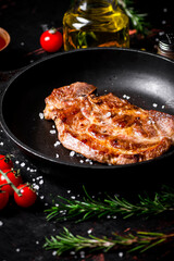 Frying pan with grilled steak. 