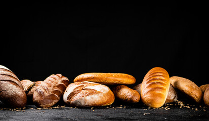 Different types of fresh bread on the table. 