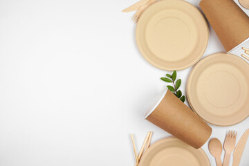 Eco friendly disposable dishware for takeout. Side border on a white background. Biodegradable,...