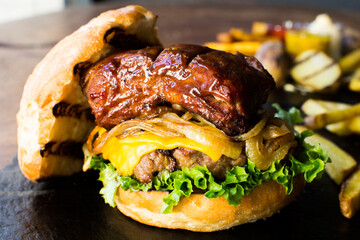Premium Authentic American Burger with a tender pork rib on top.