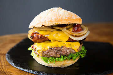 Premium Authentic American Burger with a tender pork rib on top.