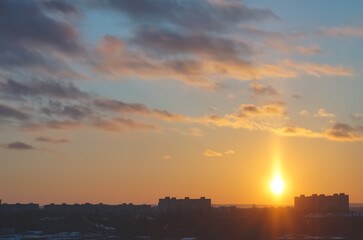 Winter cityscape with sunset in the evening, warm sunset in early winter with buildings