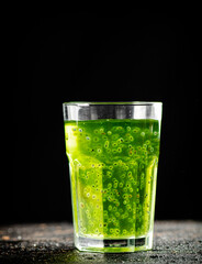 A glass of fresh kiwi juice. 