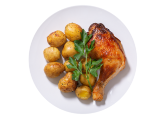 plate of baked chicken leg with potato isolated on transparent background, top view