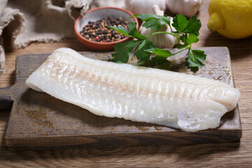 fresh fish fillet of cod with ingredients for cooking - obrazy, fototapety, plakaty