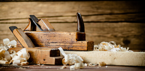 Working tool. Planer with wooden shavings. 