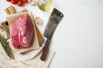 Marble beef raw, on wooden cutting board with old butcher cleaver knife, on white background, top...