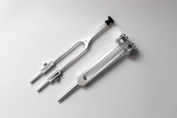 tuning fork C 128 on a white background with gradation