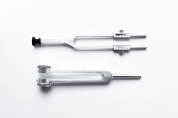 tuning fork C 128 on a white background with gradation