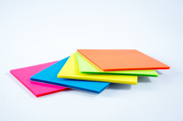 pack of bright colored transparent jot note pads to leave messages lists actions isolated on a white background