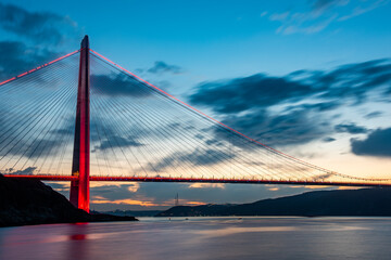 Fototapeta na wymiar Yavuz Sultan Selim Bridge in Istanbul, Turkey. 3rd bridge of Istanbul Bosphorus with blue sky. Sunset view..
