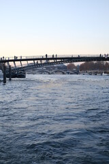 Obraz premium A view of the Seine river during dusk. December 2022, Paris, France.