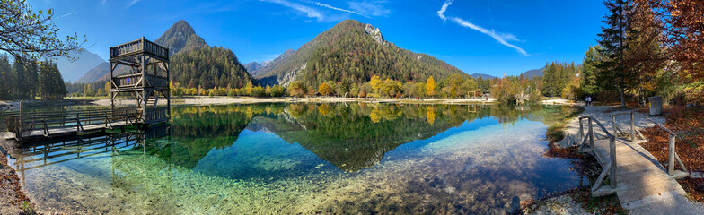 Scenic autumn forest at Crystal Lake in the Julian Alps