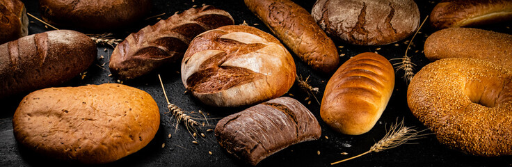Different types of fresh bread on the table. 