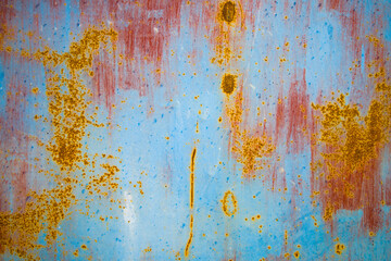 Old cracked paint in craquelure on a rusty metal surfaceGrunge rusted metal texture. Rusty corrosion and oxidized background. Worn metallic iron rusty metal background.