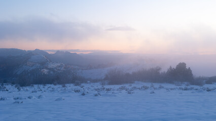 Cool blue light contrasts with the last remaining warm tones in the sky as daylight fades away and...