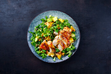 Traditional German lamb’s lettuce with chicken breast, fruit and cashew nuts served with spicy...