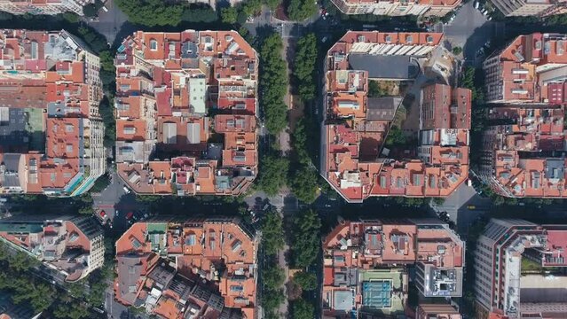 Aerial view of Barcelona Eixample residential district and old town narrow streets, gothic quarter at sunrise. Catalonia, Spain