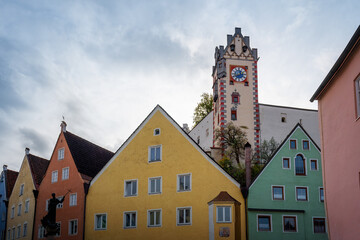 Fototapeta premium Colorful houses at Fussen Old Town (Altstadt) with High Castle (Hohes Schloss) - Fussen, Bavaria, Germany.