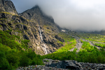 Midagradinskaya mountain valley is surrounded by a giant barrier of vertical rocks. 