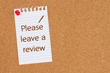 Please leave a review on ruled paper on a corkboard