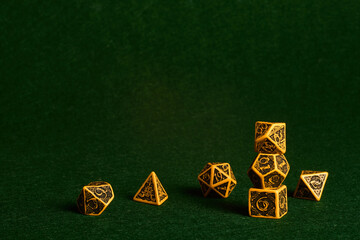 A set of dice on the green mate