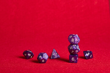 A set of dice on the pink mate