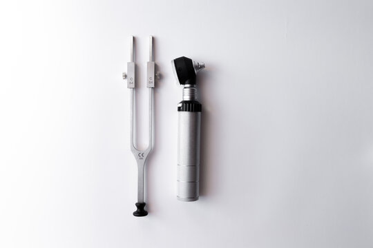 tuning fork C 128 on a white background with gradation and otorhinoscope