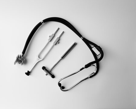 Tuning Fork C 128 On A White Background With Gradation, Neurological Hammer And Stethoscope, Medical Instruments, Equipment	