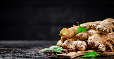 Ginger on a wooden cutting board.