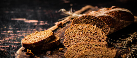 Slices of fragrant bread on a wooden cutting board.