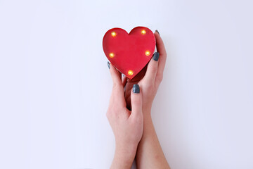 top view woman hands holding heart white background