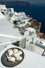 Stone decoration with Oia cityscape at Santorini island, Cyclades, Greece