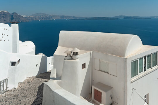 Slope passage in Oia, Santorini, Cyclades, Greece - Powered by Adobe