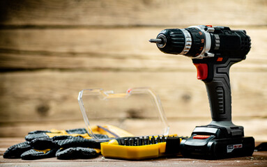 Working tools. Screwdriver bits. On a wooden background.