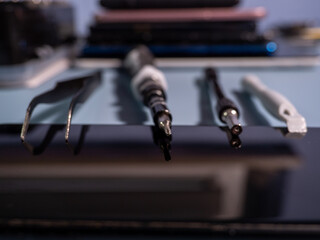 Old broken smartphone and repair tool. The concept of computer equipment, mobile phones,...