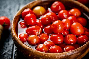 Pickling ripe homemade tomatoes on the table. 