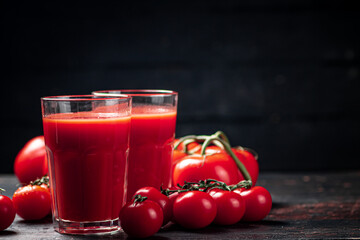 Juice from ripe tomatoes on the table. 