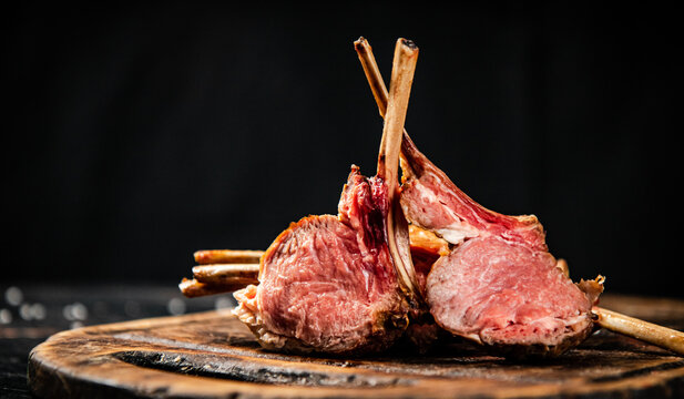 Rack of lamb grill on a cutting board. 